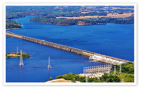 A view from below Wheeler Dam. Notice the bluff banks in the distance.