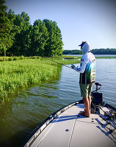 Shoreline grassbeds like this produced some good catches, using a variety of lures and techniques.