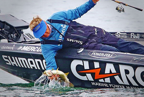 Hand lifting a big smallmouth, as no nets are allowed on the Bassmaster Elite Series.